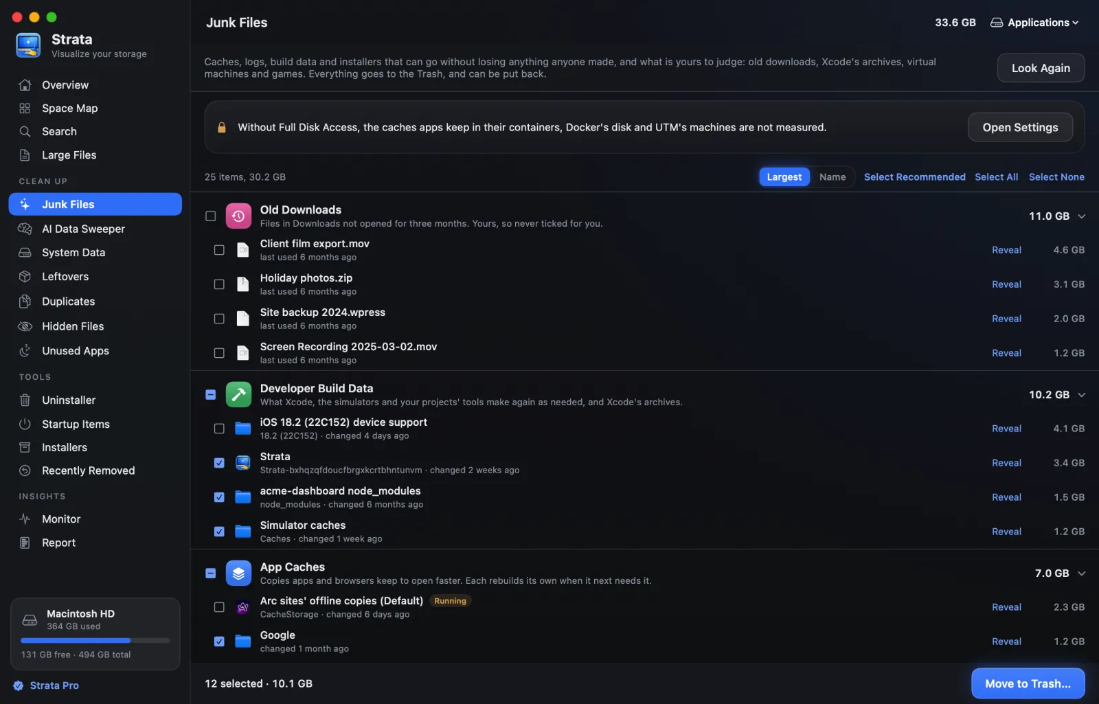 The Junk Files room: old downloads, developer build data and app caches grouped by kind, with sizes and tick boxes