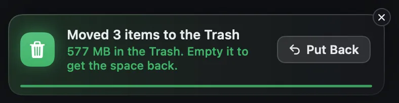 A notification from Strata: three items moved to the Trash, where 577 MB now waits until the Trash is emptied, with a Put Back button